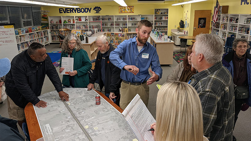 Neighbors gathered at the November 2022 open house to review the proposed design and talk with the design team.