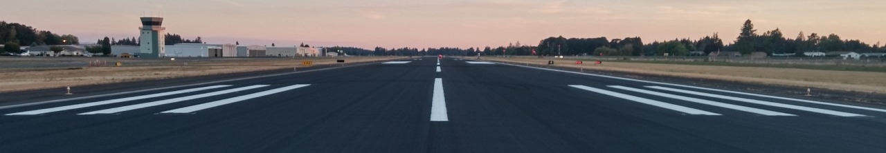 view of the runway at the Aurora State Airport showing the flight tower. 