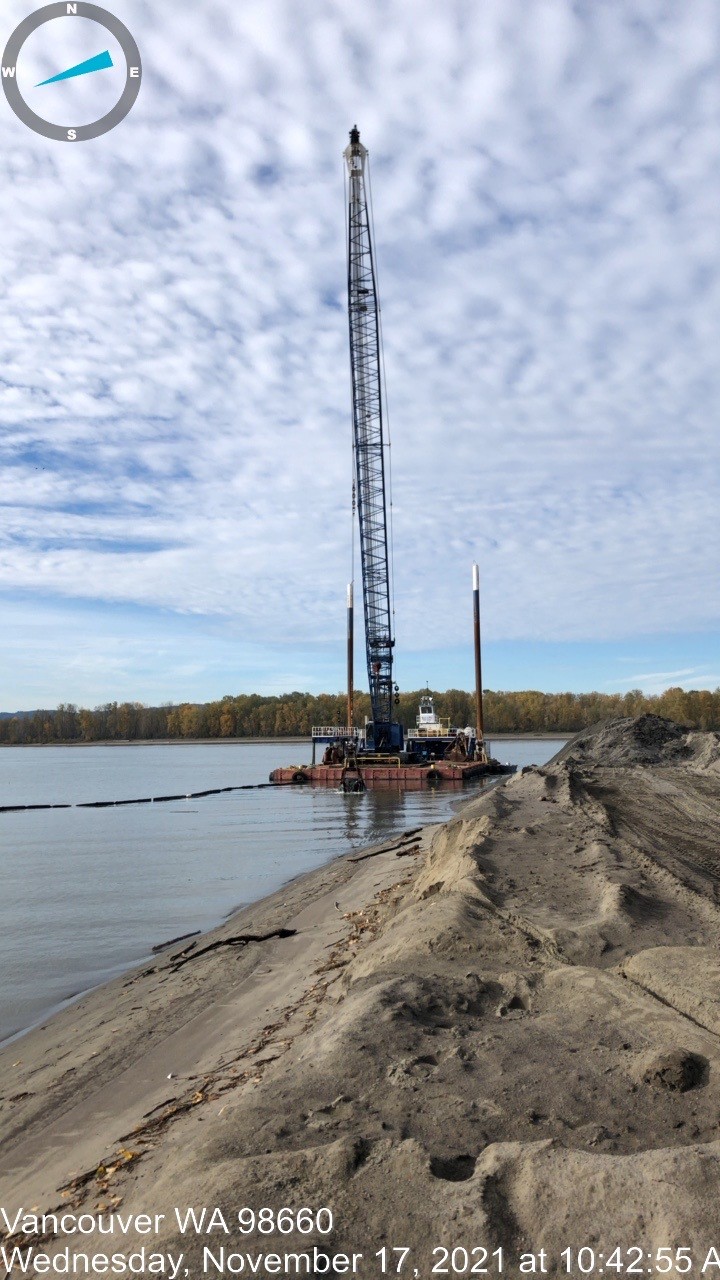 Image of outfall water work at the barge with a crane