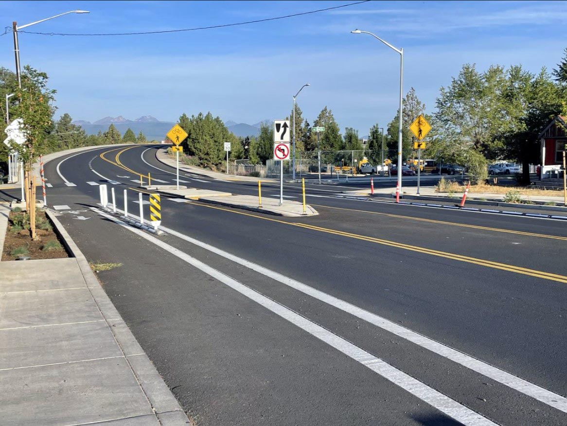 The modal filter shown here allows cyclists to travel through to the low stress street, while vehicles take an alternate route.