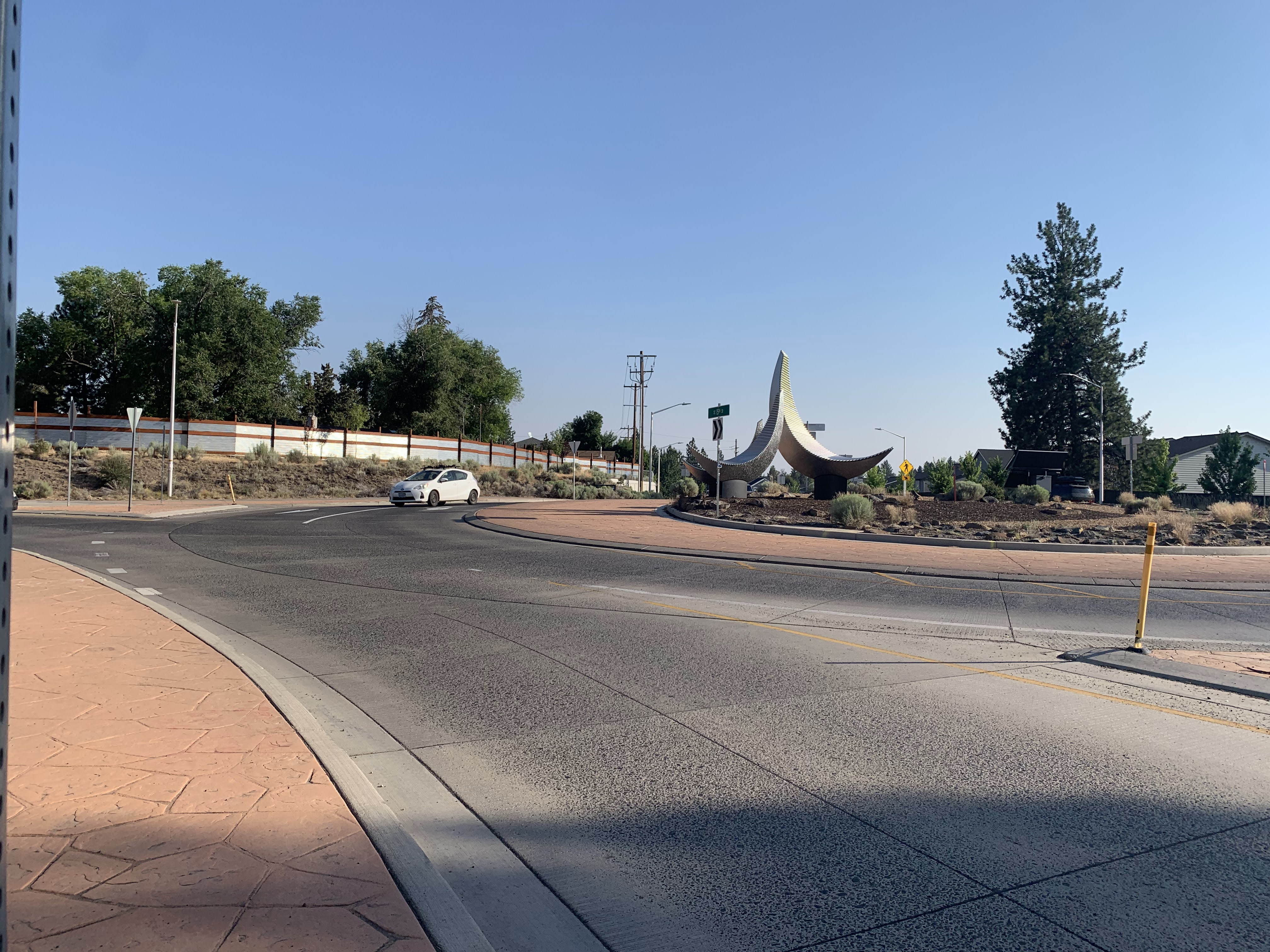 A car travels through the existing Reed Market Road and 15th Street roundabout.