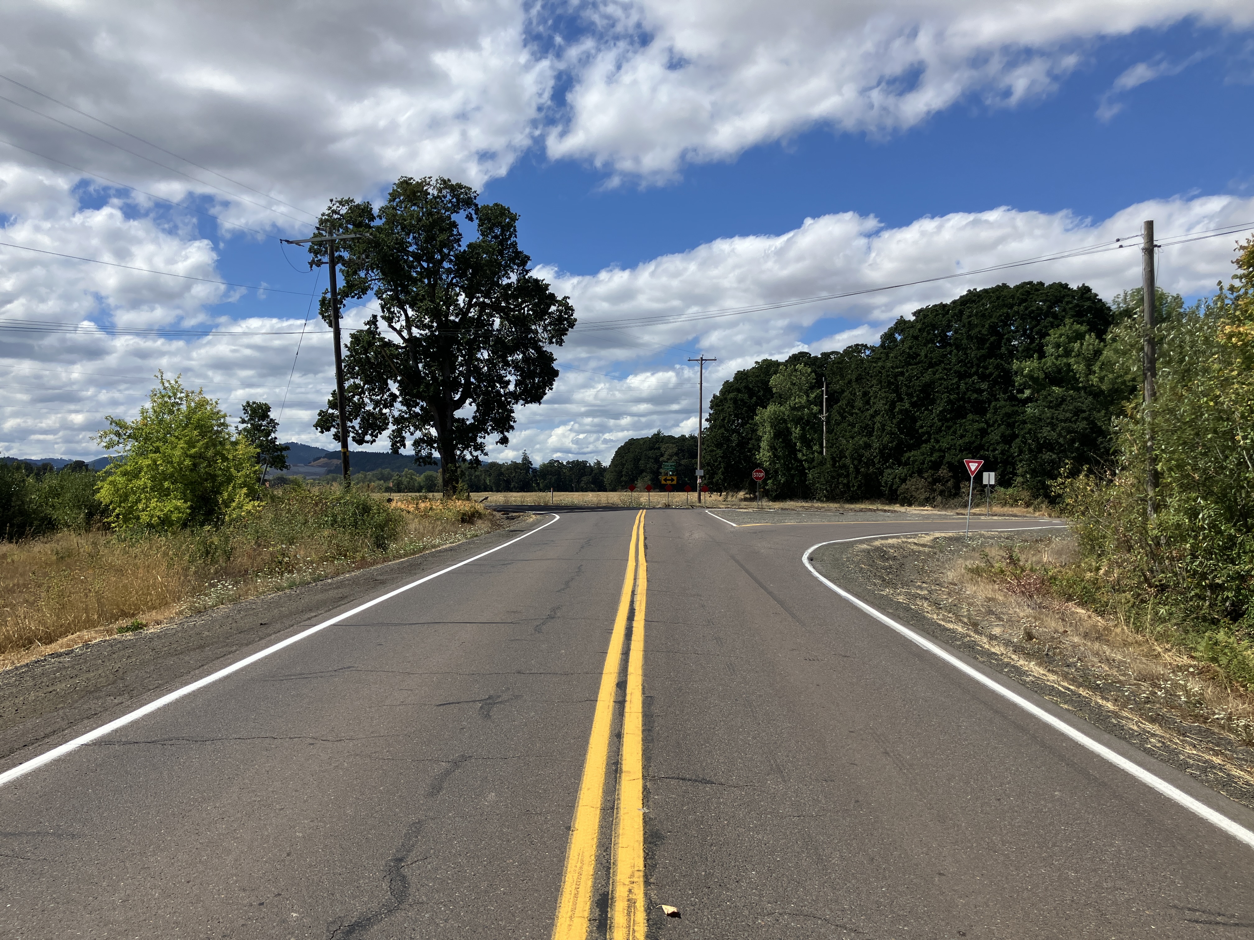 A long shot of a rural roadway. 