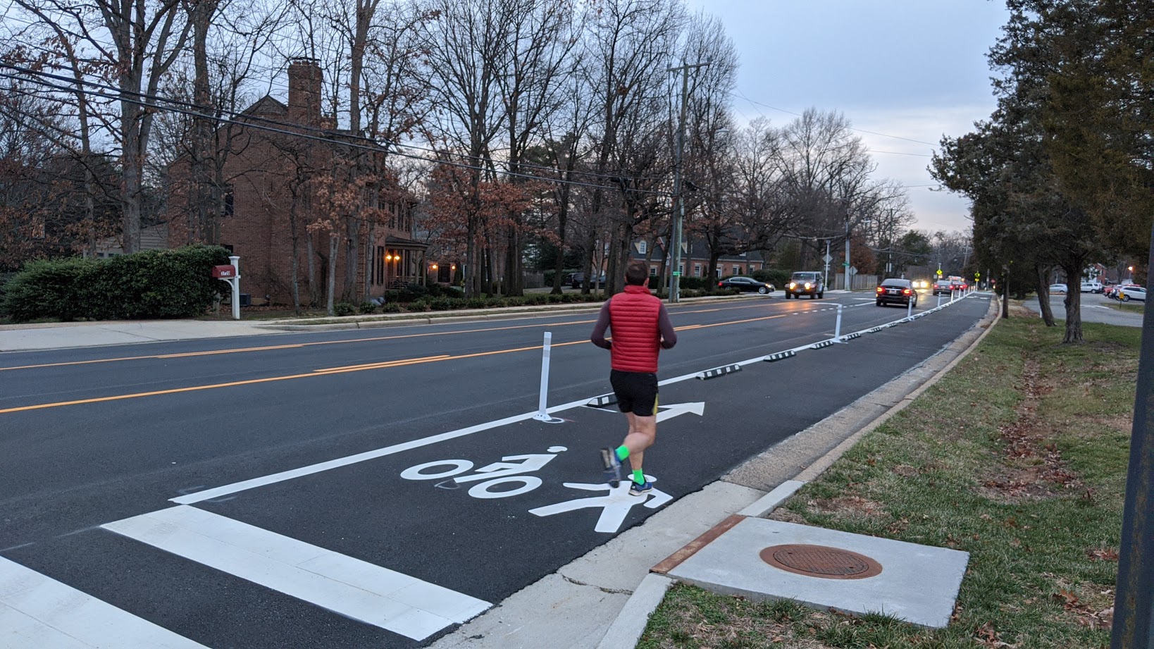 byclyclist riding in a bike lane on the street