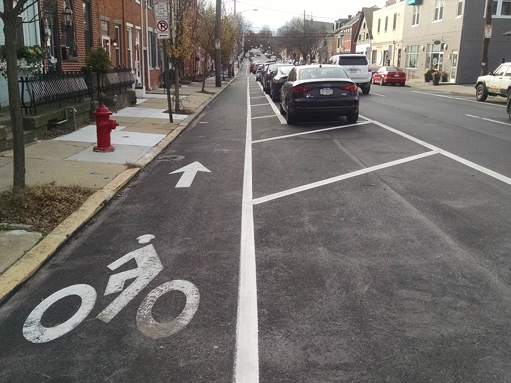 Example of floating parking spaces with curbside bike lane 